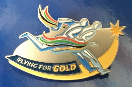LAPEL BADGE: "Flying for Gold" (image for) LAPEL BADGE: "Flying for Gold"